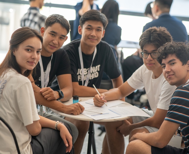 Group photo of students at Economics Olympiad